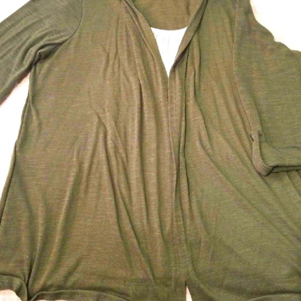 Green/cream colored 3/4 sleeve shirt.